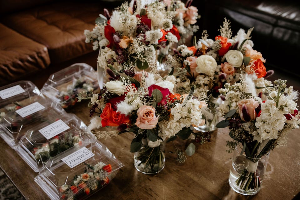 Reception table details with florals and place settings.